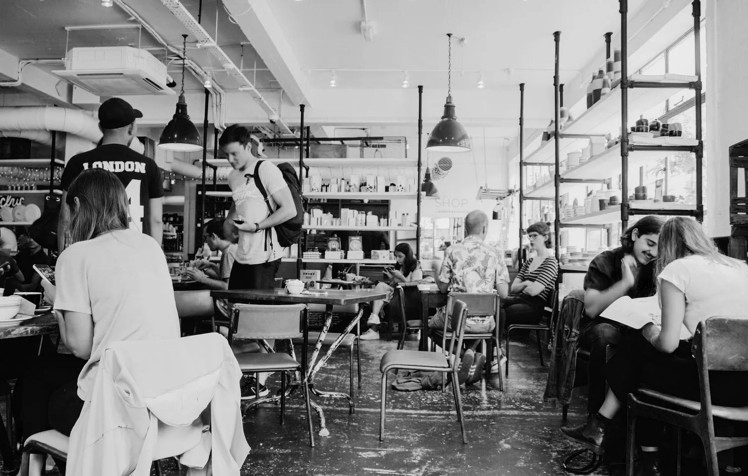 Black-and-white photo of a busy open-plan office