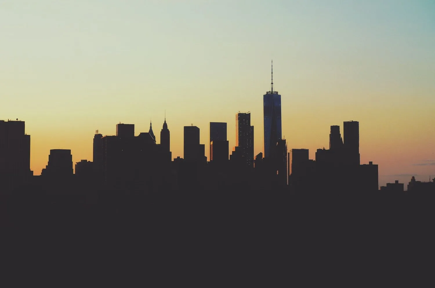 Silhouette of the Manhattan skyline at dusk