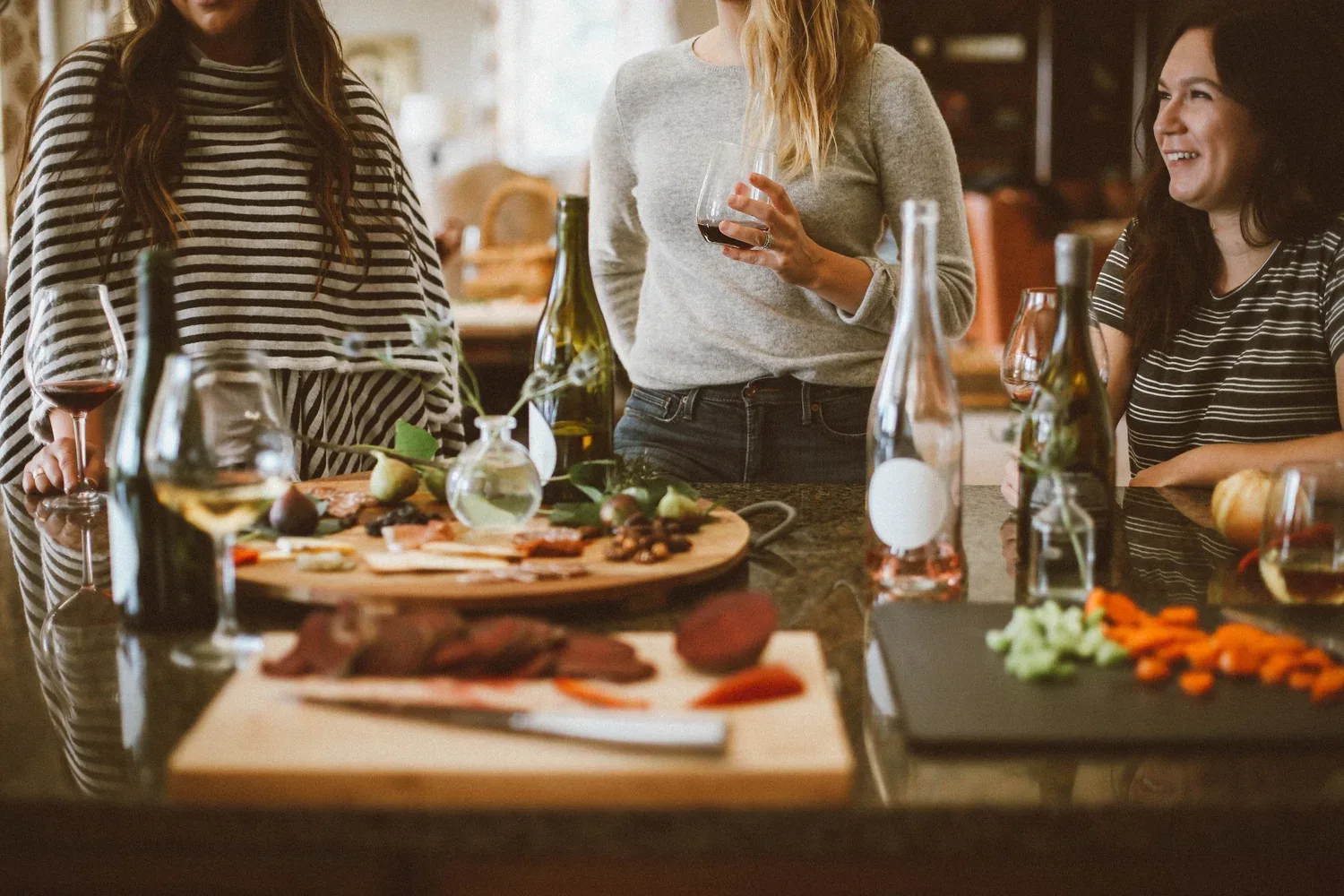 Friends sharing food and drinks around a table