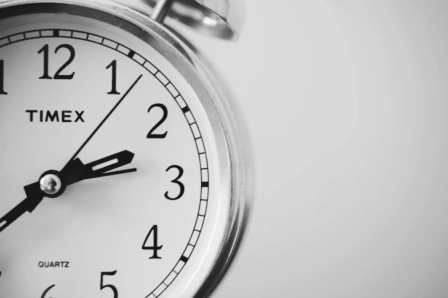 Close-up of an analog alarm clock face
