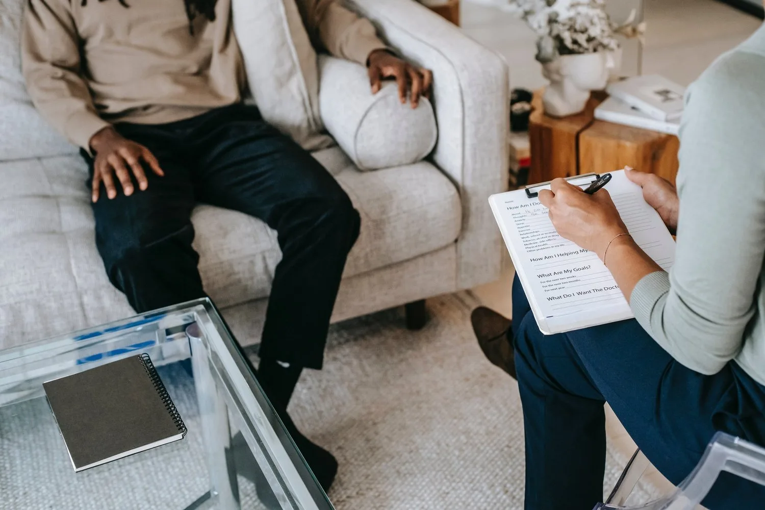 Therapist and client seated across from each other in an office