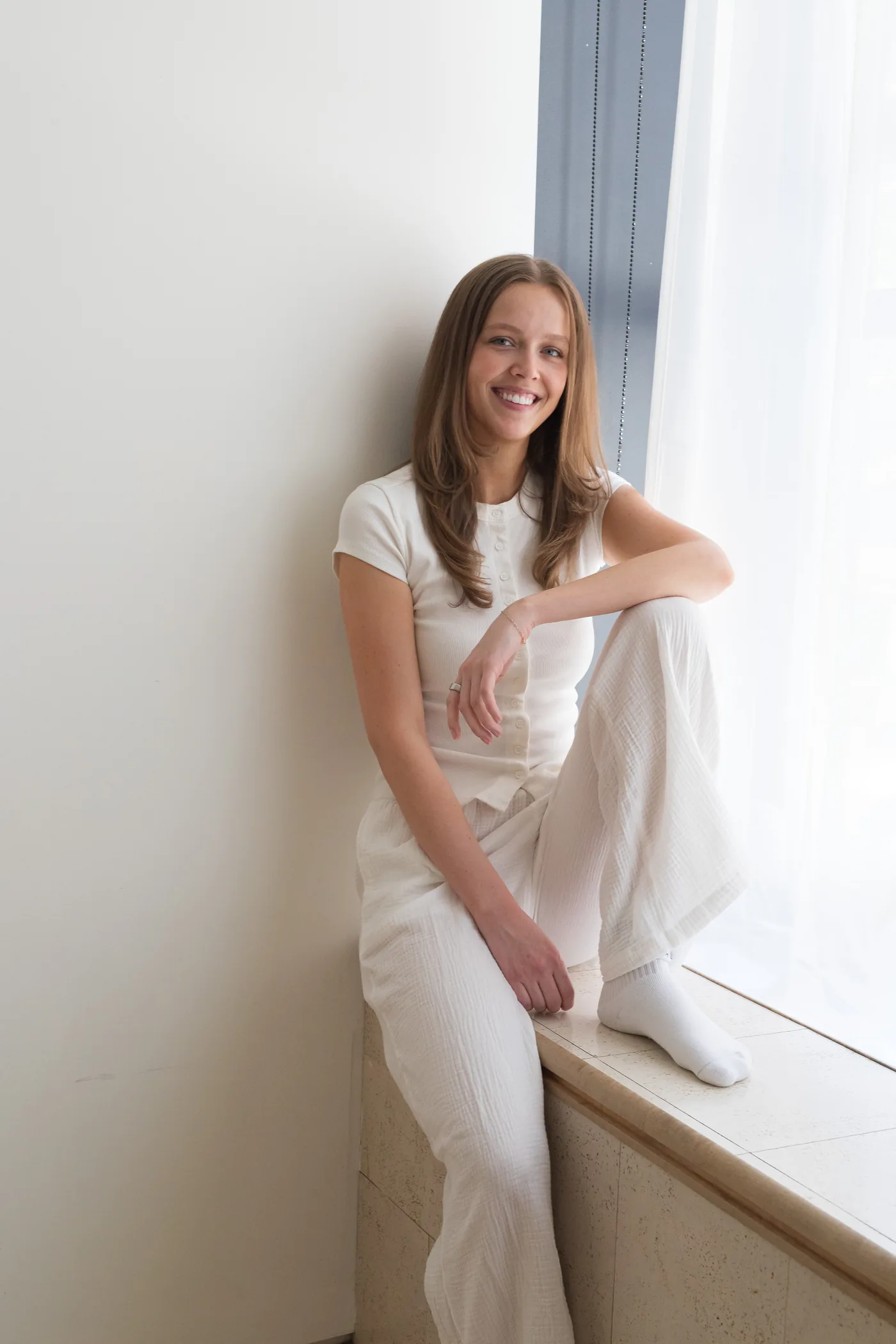 A person at home by a window